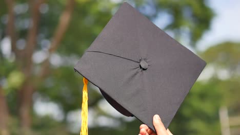 graduation cap in hand