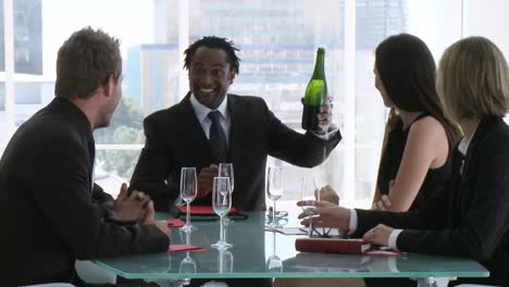 business team celebrating success with champagne
