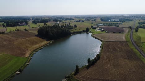 Aerial-view-of-Poland-countryside-famous-Kashubian-Lake-District,-drone-reveal-water-formation-in-natural-environment-during-sunny-day