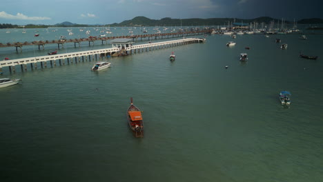 scenic pier and boats at a tropical harbor