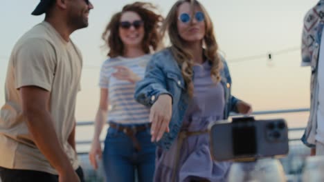 Group-of-friends-recording-dances-at-mobile-phone.