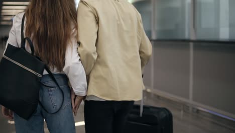 Rare-View-Of-Couple-Walking-Together-In-Airport-Going-On-Vacation-Or-Trip