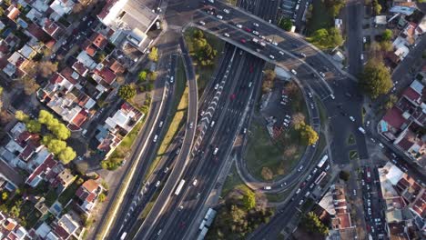 aerial top down view of vehicular traffic on modern multilevel interstate overpass in buenos aires