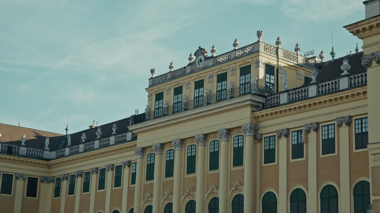 Schönbrunn Palace rooftop details in Vienna, Austria under a clear blue sky