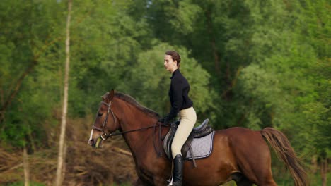 woman riding horse in a field