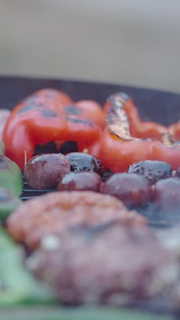 assorted food cooking on a hot grill