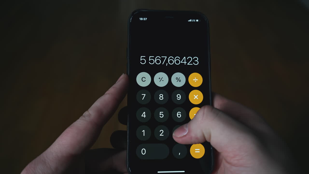 Person using a smartphone calculator app
