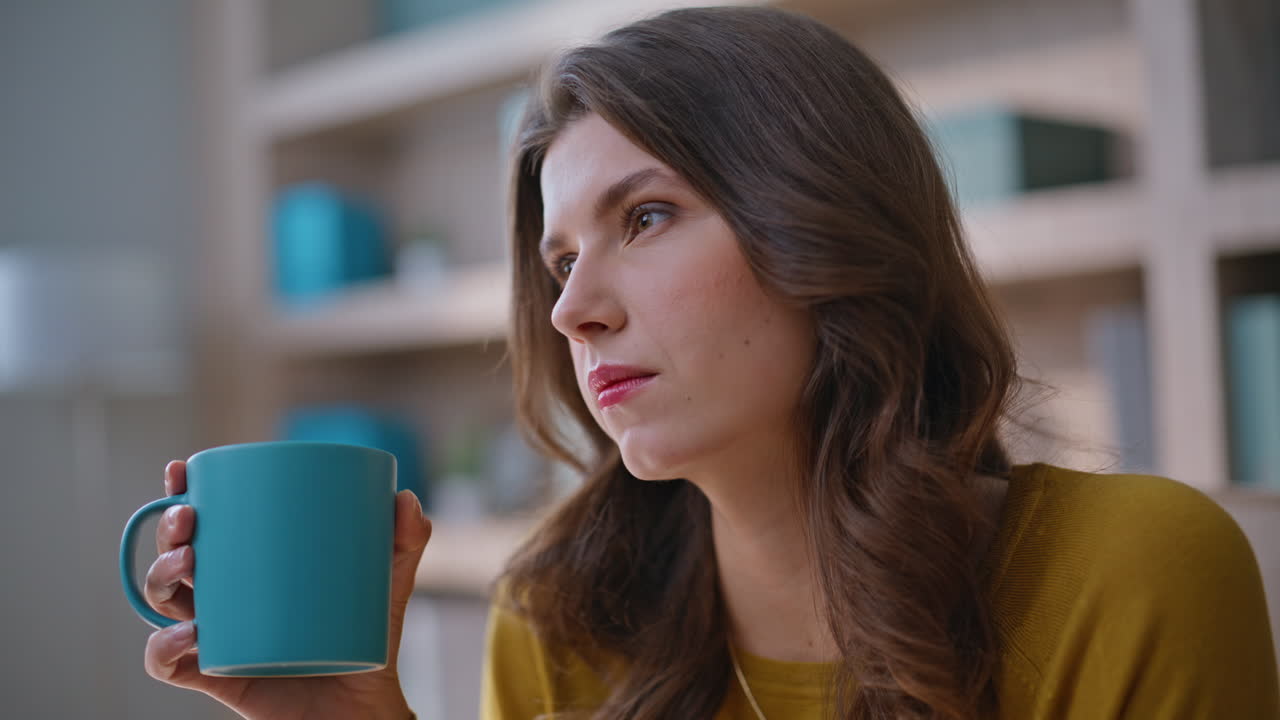 Office woman start work at laptop after drinking coffee at workplace closeup