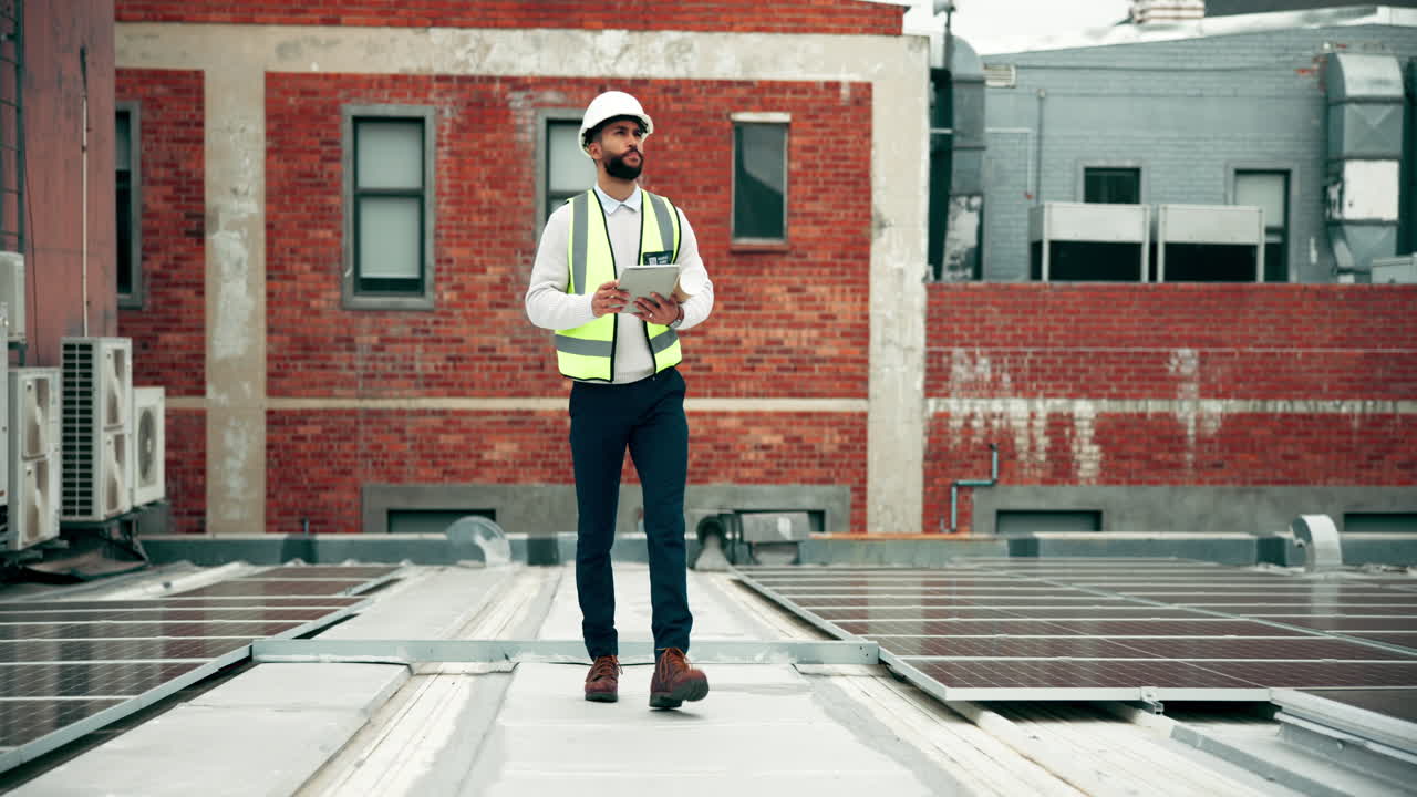 Engineer Inspecting Solar Panels on Rooftop