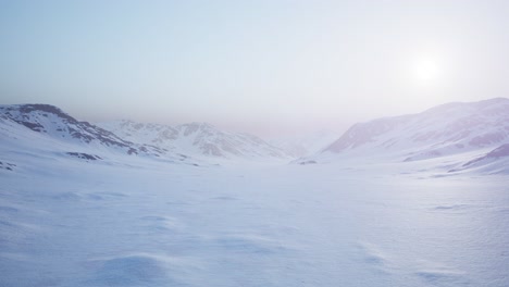 Aerial-Landscape-of-snowy-mountains-and-icy-shores-in-Antarctica