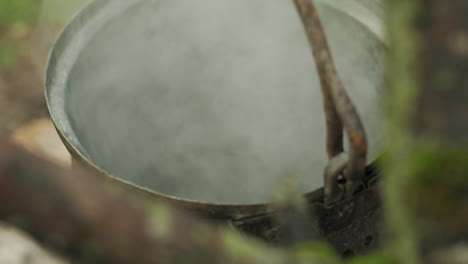 Boiling-steam-coming-out-of-a-which-kettle,-brewing-potion,-magical-scene-shot-in-closeup