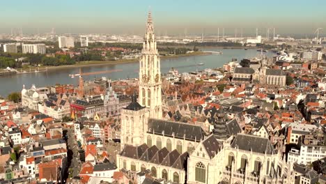 cathedral of our lady amid antwerp cityscape and scheldt river, belgium - aerial wide panoramic shot