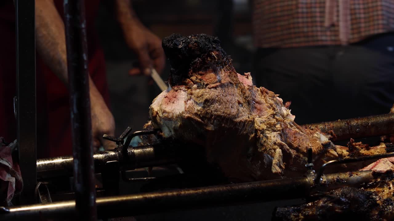 Street Food. Pork being cooked over hot charcoal fire