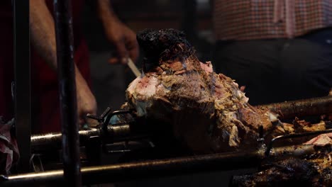 street food. pork being cooked over hot charcoal fire