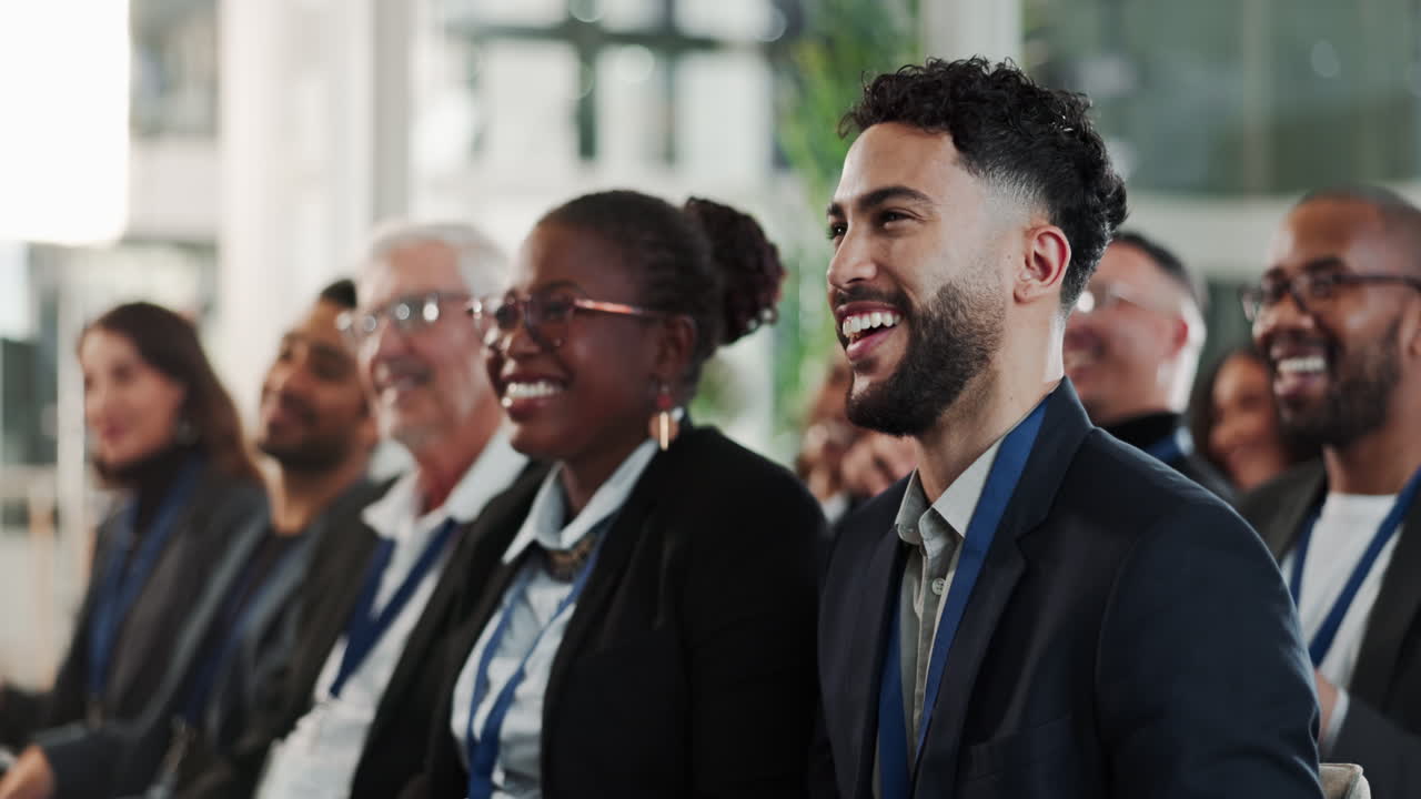 Diverse group of businesspeople applauding at a conference