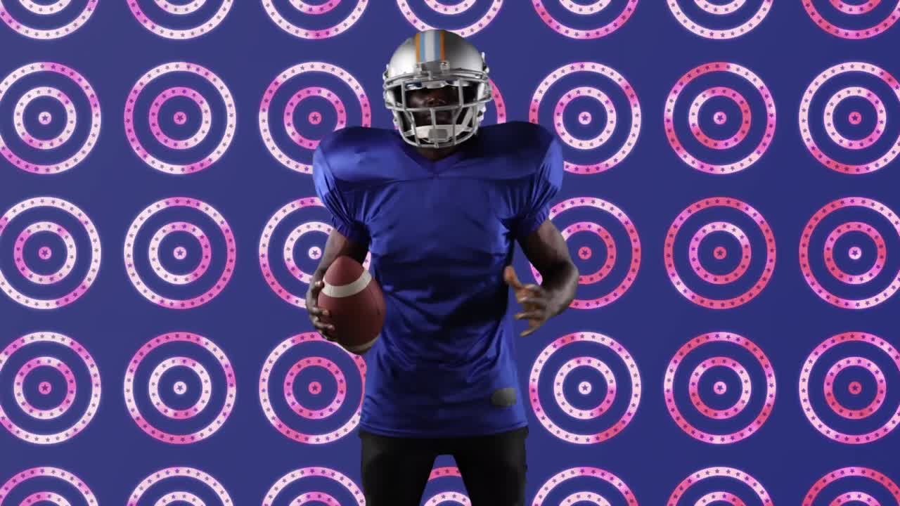 jugador de rugby afroamericano sosteniendo una pelota de pie contra múltiples estrellas en círculos giratorios