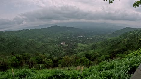 timelapse of dramatic monsoon clouds rolling over lush green mountains and swaying trees in panchgani, maharashtra, india nature at its vibrant best, alive with mist, wind, and rich earthy hues