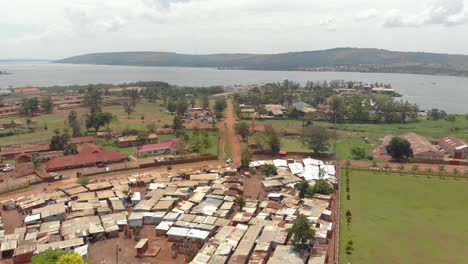 aerial shot of a small slum on the shores of lake victoria