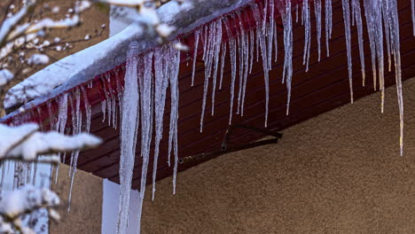 Process-Of-Icicles-Forming-At-Rain-Gutter-On-The-Roof