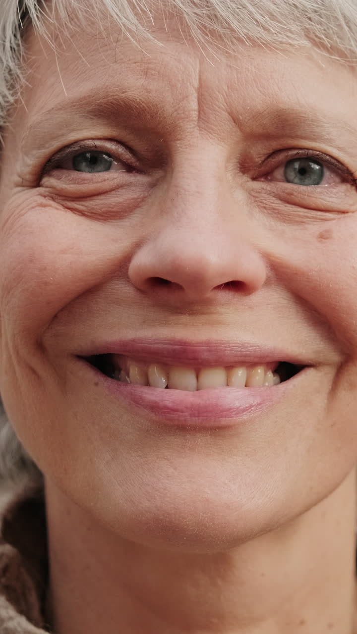 Close-up of Senior Woman Opening Eyes and Smiling
