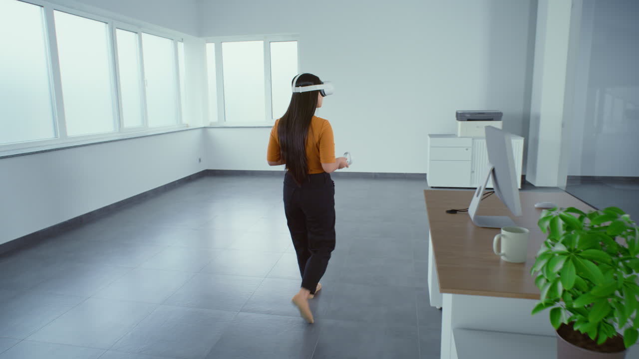 Woman using VR headset in modern office