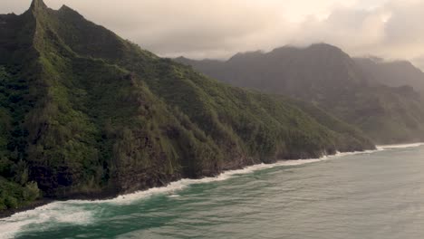 Dramatic-footage-revealing-famous-Haena-park,-and-Kalalau-trail-by-NaPali-coast-during-sunset