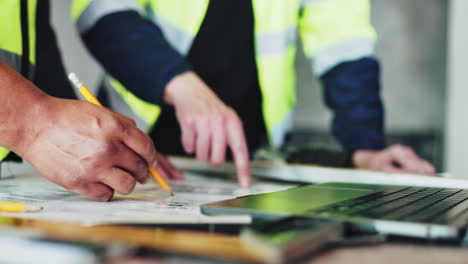 construction workers reviewing plans