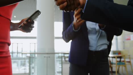 business people shaking hands in office 4k