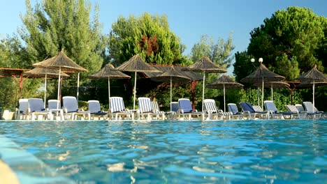 pool, sunbeds, umbrellas