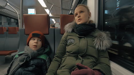 mother and child having a ride in suburban train