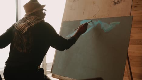 artist painting in a studio