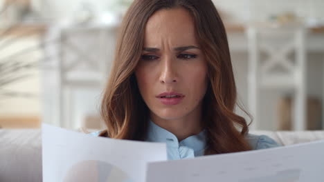 focused business woman working with documents at home office