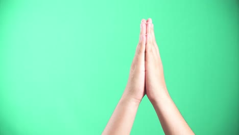 a person putting their palms together in prayer. 4k green screen