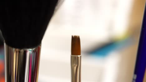 Rack-focus-slight-pullback-of-wide-thin-small-fine-tip-oil-painting-brush