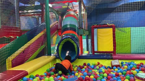 exotic two-year-old black baby having fun in a children’s park