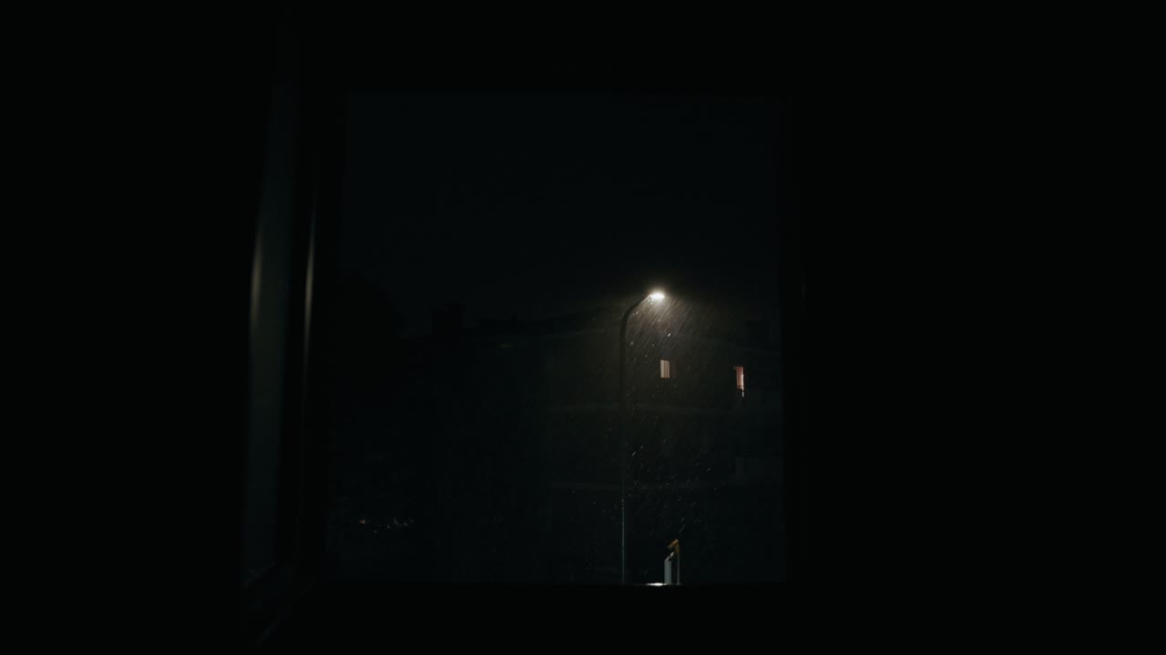 View Through Apartment Window Of Thunderstorm At Night In Bassano del Grappa, Italy. dolly-in shot