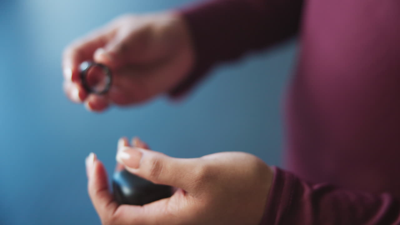 Close-up of a woman's hand wearing a ring