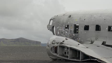 hand-held shot of the sólheimasandur dc3 plane crash on the shore of iceland