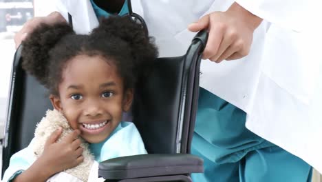 Cute-Little-girl-sitting-in-a-wheelchair-