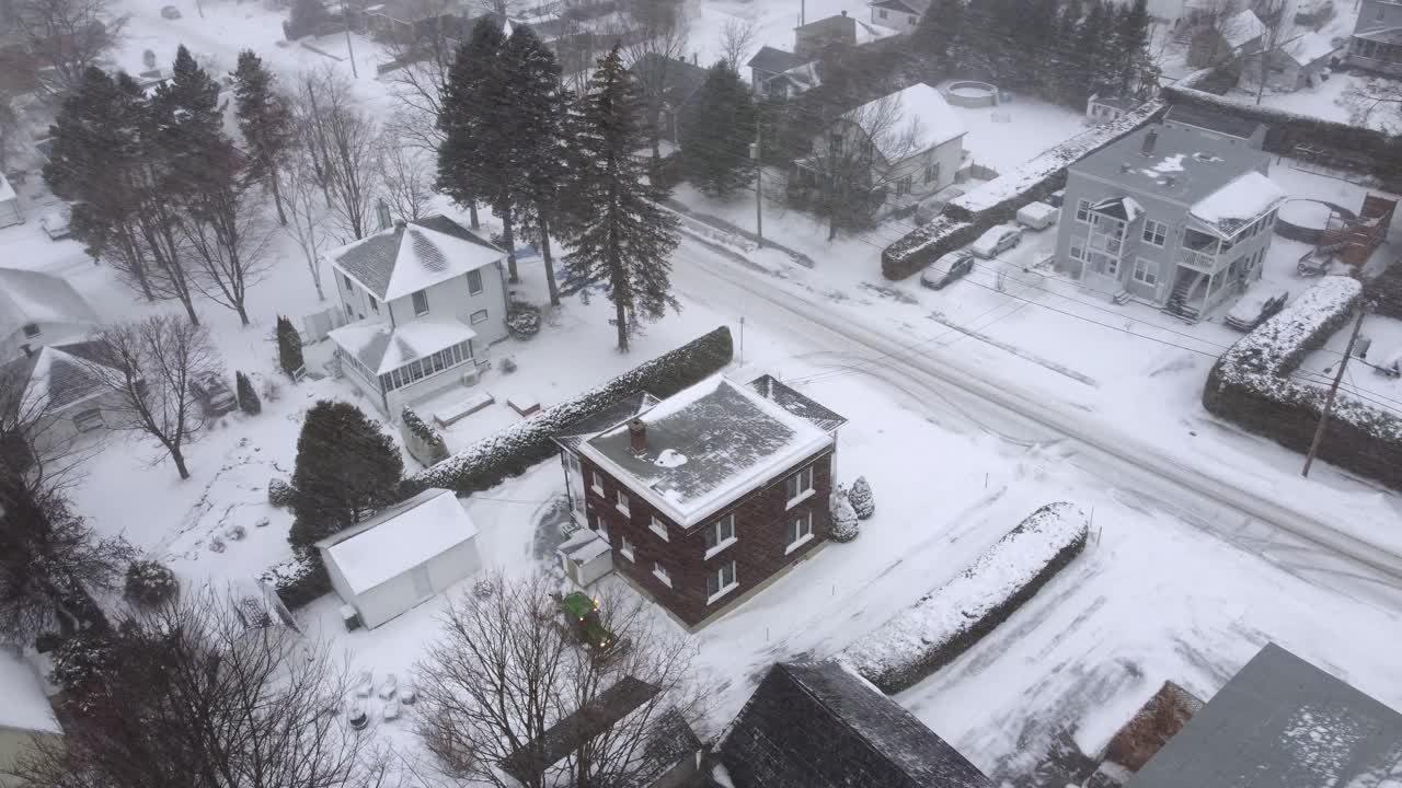 Snowy aerial view of residential houses and street in Orford, Québec, Canada