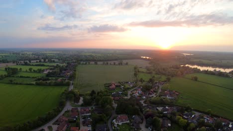 aerial drone footage of a sunset over the norfolk village of south walsham