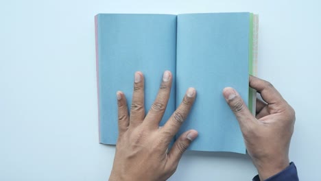 hands holding open book