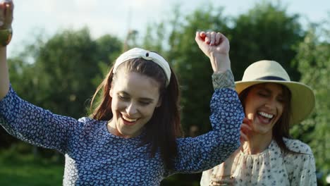 video of two happy friends jumping and dancing outside