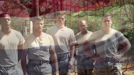 animation of flag of germany waving over portrait of soldiers during exercising