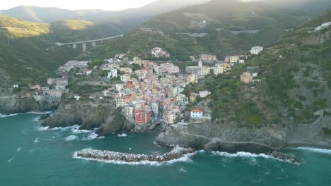 cinematic establishing shot above riomaggiore, cinque terre in italian tourist destination