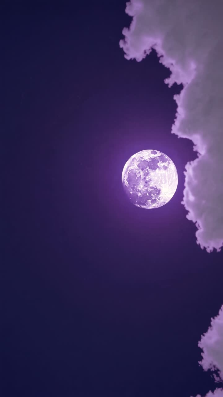 A mystical full moon glowing purple against a dark sky, partially obscured by clouds