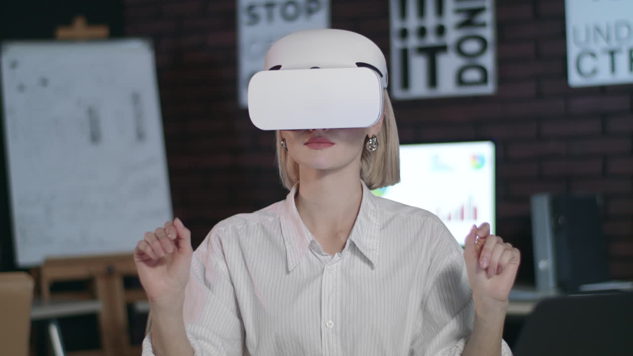 Business woman working in cyberspace in office. Woman designer using VR glasses.