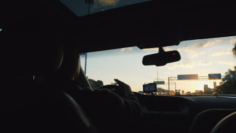 Couple-Driving-at-Sunset