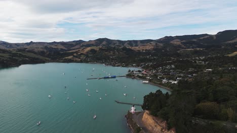 akaroa town in the canterbury region, new zealand. aerial