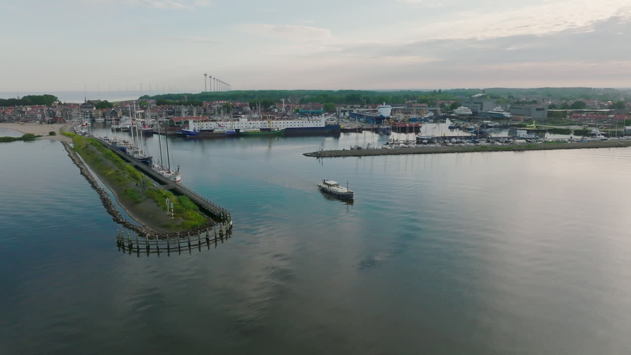 Aerial dolly in shot of The Luxemotor Dutch Boat leaves the port in Holland
